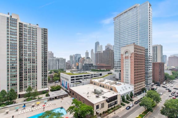 an aerial view of a city with tall buildings and a parking lot