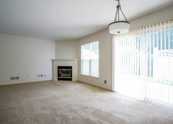 Great room view showing fireplace and sliding doors to private patio