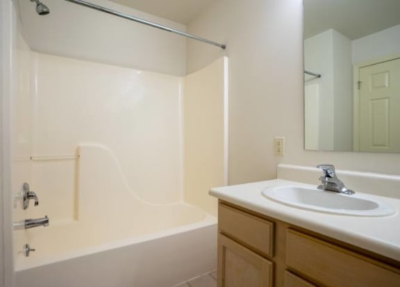 Full bathroom with view of shower/tub combo