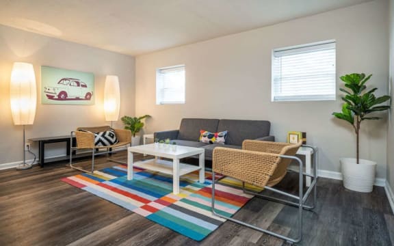 a living room with a couch and a coffee table at Viceroy Apartments, Durham , 27707