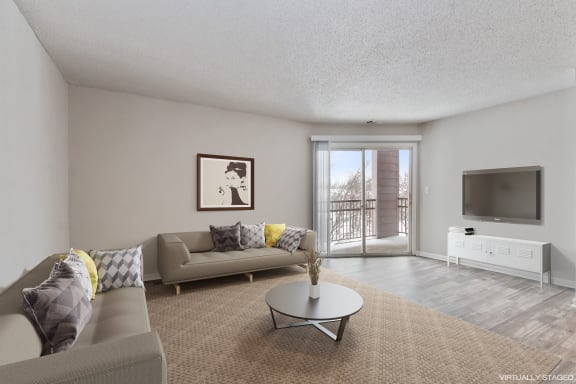 a living room with a couch and a table and a tv