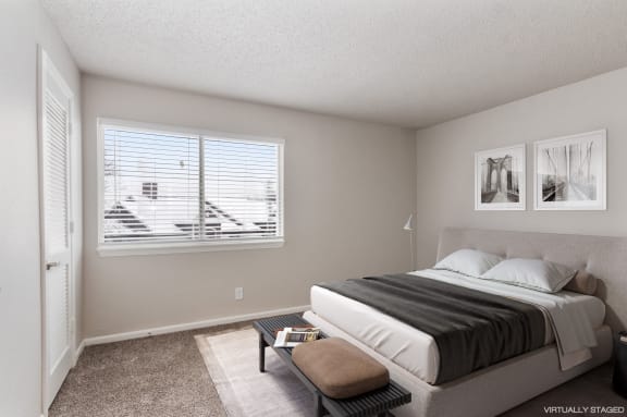 a bedroom with a bed and a window
