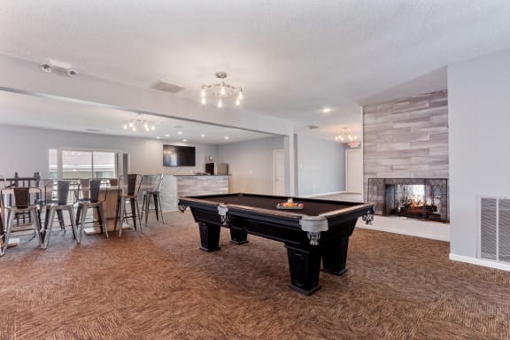 the preserve at ballantyne commons clubhouse with pool table and fireplace