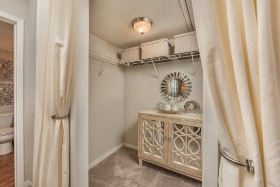 a bathroom with a vanity and a shower and a curtain