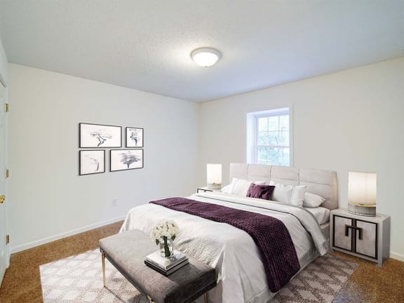 an empty bedroom with a bed and a window