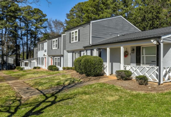 A row of houses with a green lawn in front  at Greenwood Village, Charlotte, NC, 28273