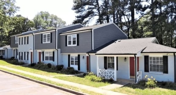 A white house with a red door and black shutters at Greenwood Village, Charlotte, NC, 28273