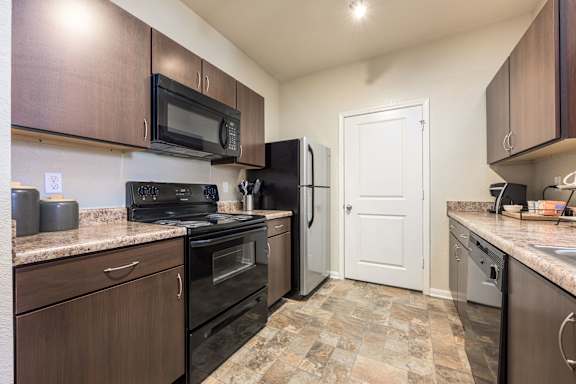 Kitchen with a Black Refrigerator at Spring Creek Apartments, Crestview