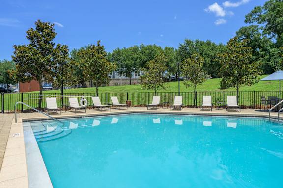 Pool Surrounded by Trees at Spring Creek Apartments, Florida, 32536