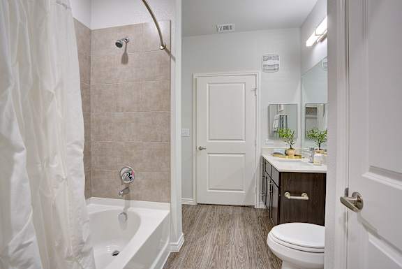 Bathroom with toilet and bathtub at Edge and Stone, San Antonio, TX, 78260