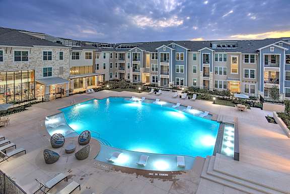 Pool view at night at Edge and Stone, Texas, 78260