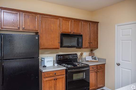 Refrigerator And Kitchen Appliances at Mill Creek Run Apartments, Macon, GA