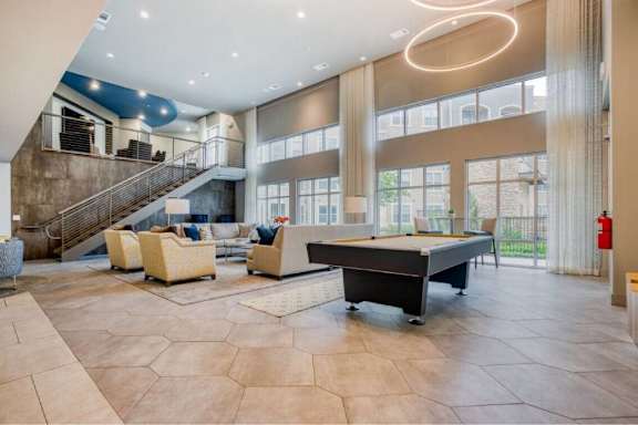 Large living room with a piano at The Mark at Huebner Oaks, San Antonio