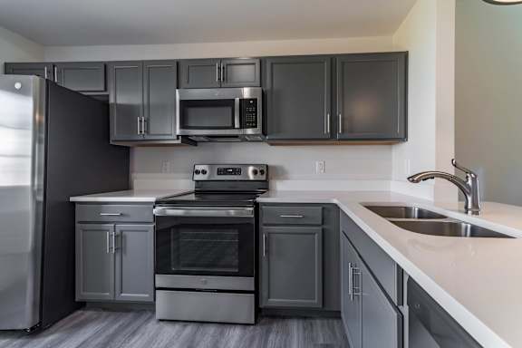 Kitchen with dark cabinets at Arrowood Farms, Clarksville, TN