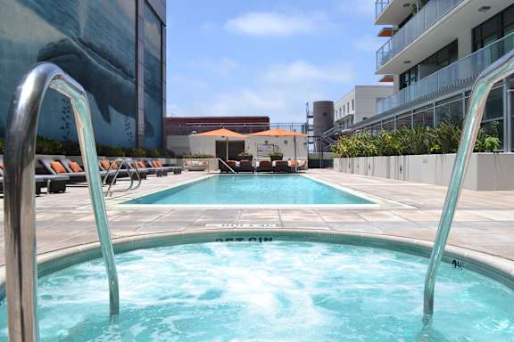 A swimming pool with a slide in the middle.