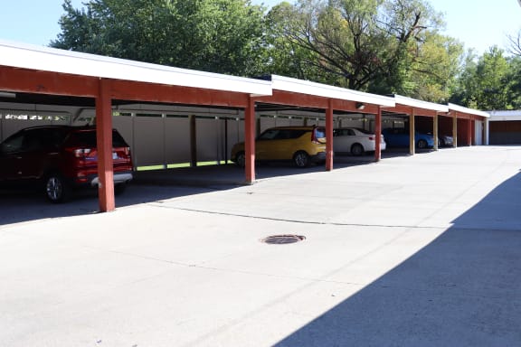 a covered parking lot with cars parked in it