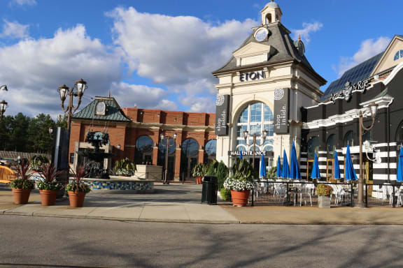 a building with a clock tower on the corner of a street