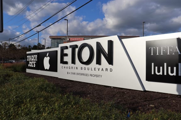 a sign collaborative sign in front of a building