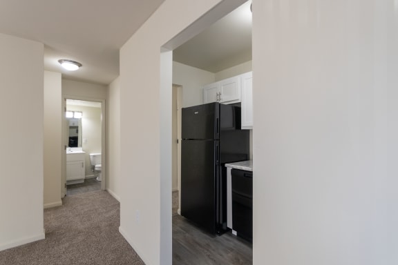 This is a photo of the entry to the kitchen and hallway in the 543 square foot B-style, 1 bedroom, 1 bath apartment at Blue Grass Manor Apartments in Erlanger, KY.