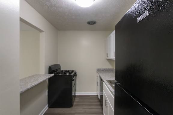 This is a photo of the kitchen in the 543 square foot A-style, 1 bedroom, 1 bath apartment at Blue Grass Manor Apartments in Erlanger, KY.