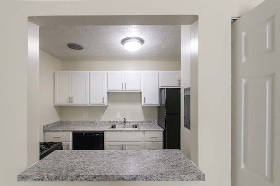 This is a photo of the kitchen pass through window in the 543 square foot A-style, 1 bedroom, 1 bath apartment at Blue Grass Manor Apartments in Erlanger, KY.
