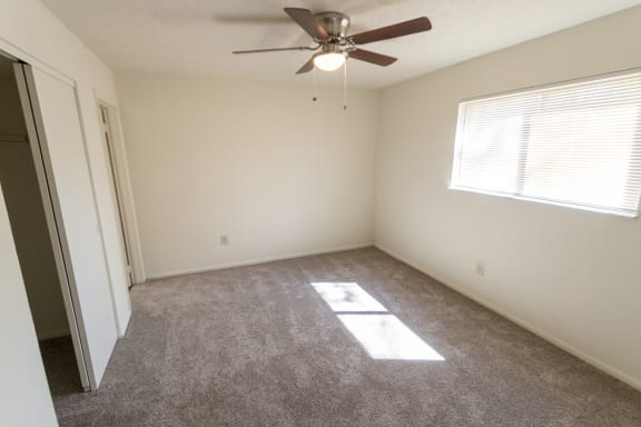 This is a photo of the master bedroom in the 899 square foot, 2 bedroom, 1 and a half bath apartment at Blue Grass Manor Apartments in Erlanger, KY.