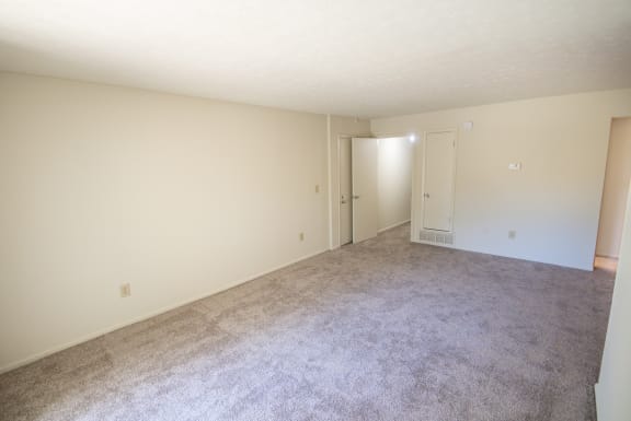 This is a photo of the living room in the 899 square foot, 2 bedroom, 1 and a half bath apartment at Blue Grass Manor Apartments in Erlanger, KY.