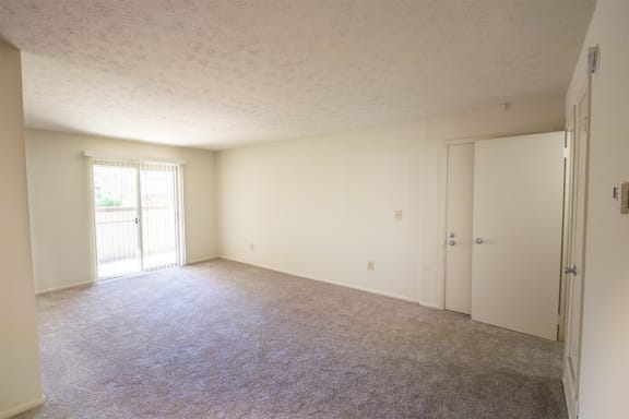 This is a photo of the living room in the 899 square foot, 2 bedroom, 1 and a half bath apartment at Blue Grass Manor Apartments in Erlanger, KY.