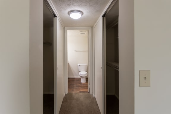 This is a photo of the master bedroom hallway closets looking towards the master bathroom in the 938 square foot , 2 bedroom, 2 bath apartment at Blue Grass Manor Apartments in Erlanger, KY