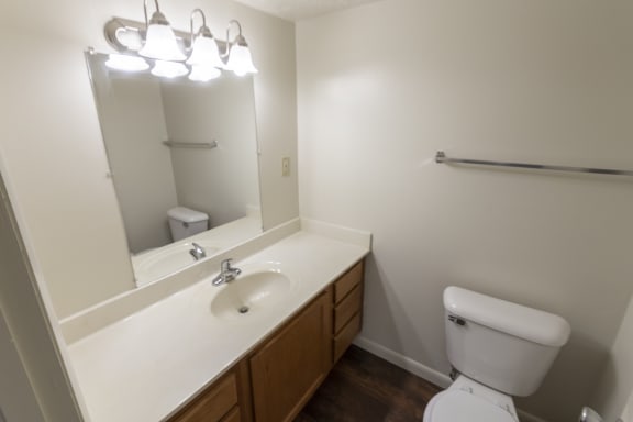 This is a photo of the master half bath in the 938 square foot, 2 bedroom, 1 and a half bath apartment at Blue Grass Manor Apartments in Erlanger, KY