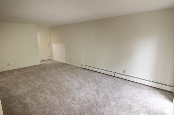 This is a photo of the living room in the 865 square foot, 2 bedroom, 1 and a half bath apartment at Blue Grass Manor Apartments in Erlanger, KY.