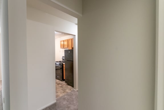 This is a photo of the hallway in the 865 square foot, 2 bedroom, 1 and a half bath apartment at Blue Grass Manor Apartments in Erlanger, KY.