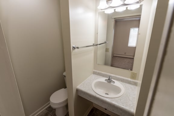 This is a photo of the master half bathroom in the 865 square foot, 2 bedroom, 1 and a half bath apartment at Blue Grass Manor Apartments in Erlanger, KY.