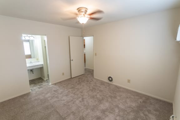 This is a photo of the master bedroom in the 865 square foot, 2 bedroom, 1 and a half bath apartment at Blue Grass Manor Apartments in Erlanger, KY.