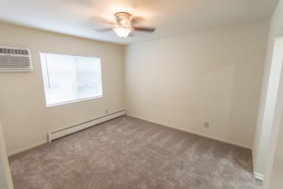 This is a photo of the master bedroom in the 865 square foot, 2 bedroom, 1 and a half bath apartment at Blue Grass Manor Apartments in Erlanger, KY.