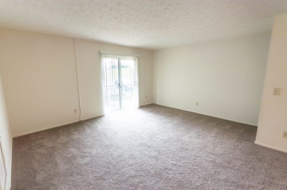 This is a photo of the living room of the 902 square foot, 2 bedroom, 1 and a half bath apartment at Blue Grass Manor Apartments in Erlanger, KY.