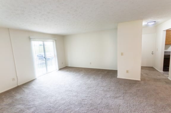 This is a photo of the living room of the 902 square foot, 2 bedroom, 1 and a half bath apartment at Blue Grass Manor Apartments in Erlanger, KY.