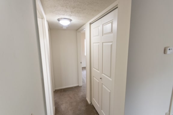 This is a photo of hallway of the 902 square foot, 2 bedroom, 1 and a half bath apartment at Blue Grass Manor Apartments in Erlanger, KY.