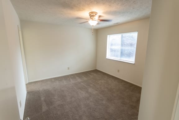 This is a photo of master bedroom of the 902 square foot, 2 bedroom, 1 and a half bath apartment at Blue Grass Manor Apartments in Erlanger, KY.