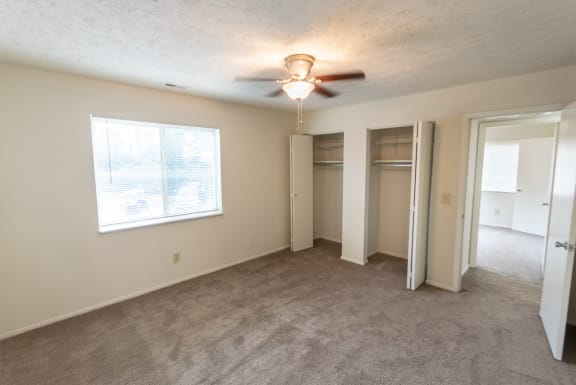 This is a photo of master bedroom of the 902 square foot, 2 bedroom, 1 and a half bath apartment at Blue Grass Manor Apartments in Erlanger, KY.