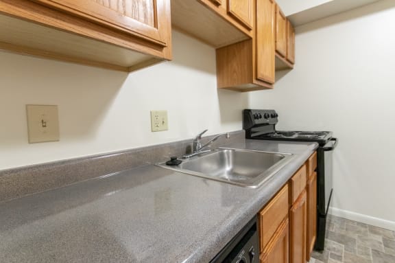 This is a photo of kitchen of the 902 square foot, 2 bedroom, 1 and a half bath apartment at Blue Grass Manor Apartments in Erlanger, KY.