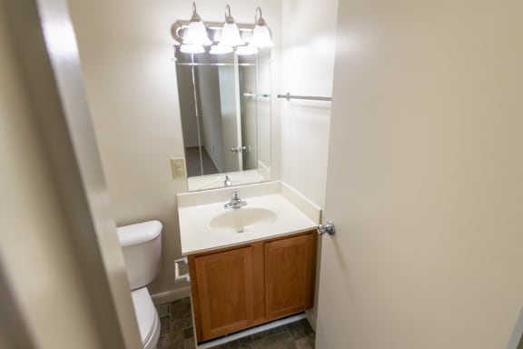 This is a photo of master half bath in the 902 square foot, 2 bedroom, 1 and a half bath apartment at Blue Grass Manor Apartments in Erlanger, KY.