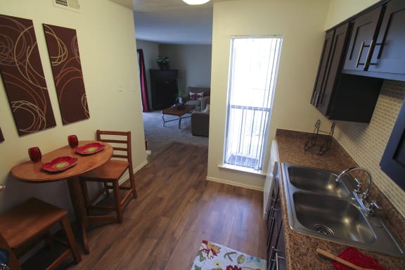 Hardwood vinyl flooring in the kitchen of the 590 square foot 1 bedroom model apartment  at The Biltmore, Texas