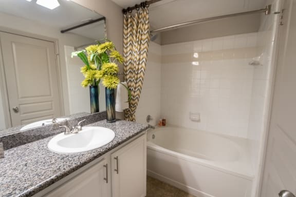 This is a photo of the bathroom in the 826 square foot 1 bedroom , 1 bath apartment at The Brownstones Townhome Apartments in Dallas, TX.