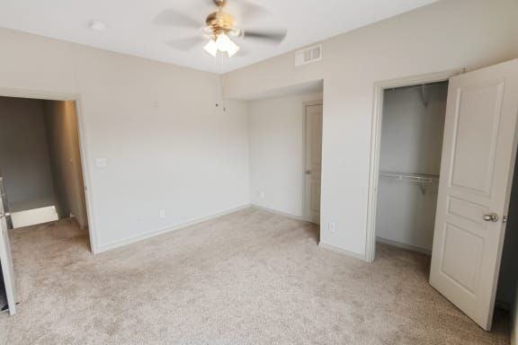 This is a picture of the second bedroom in the 1320 square foot 2 bedroom, 2 and 1/2 bath floor plan at The Brownstones Townhome Apartments in Dallas, TX..