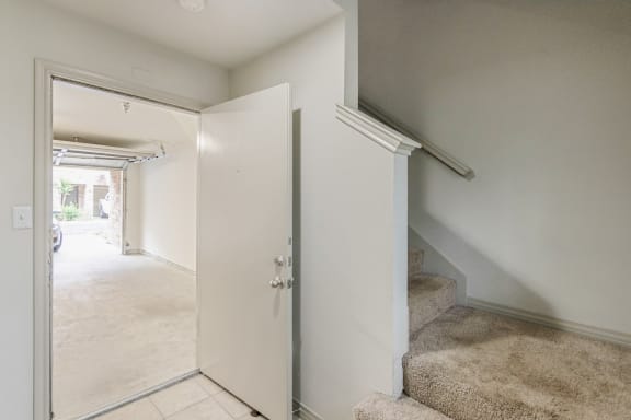 This is a picture of the entryway of the 1320 square foot 2 bedroom, 2 and 1/2 bath floor plan at The Brownstones Townhome Apartments in Dallas, TX..