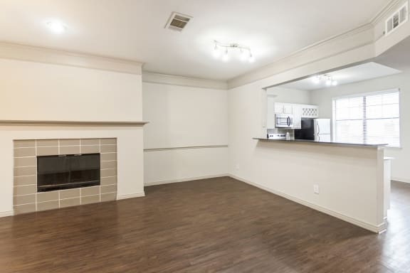 This is a picture of the dining area of the 1320 square foot 2 bedroom, 2 and 1/2 bath floor plan at The Brownstones Townhome Apartments in Dallas, TX..