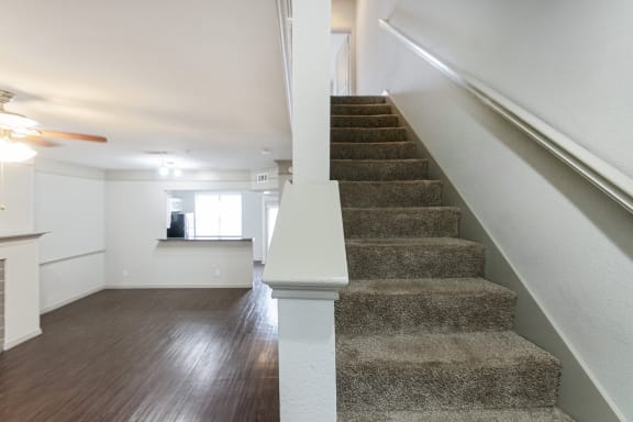 This is a picture of the stairs to the third floor of the 1320 square foot 2 bedroom, 2 and 1/2 bath floor plan at The Brownstones Townhome Apartments in Dallas, TX..