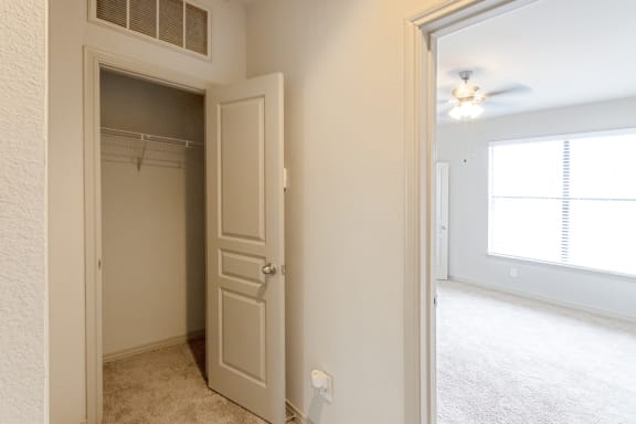 This is a picture of the third floor hallway closet of the 1320 square foot 2 bedroom, 2 and 1/2 bath floor plan at The Brownstones Townhome Apartments in Dallas, TX..