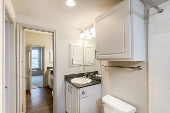 This is a picture of the second floor bathroom with full tub in the of the 1320 square foot 2 bedroom, 2 and 1/2 bath floor plan at The Brownstones Townhome Apartments in Dallas, TX..